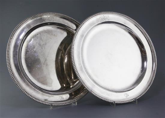 A pair of George III circular meat platters by Robert Sharp, 94 oz.